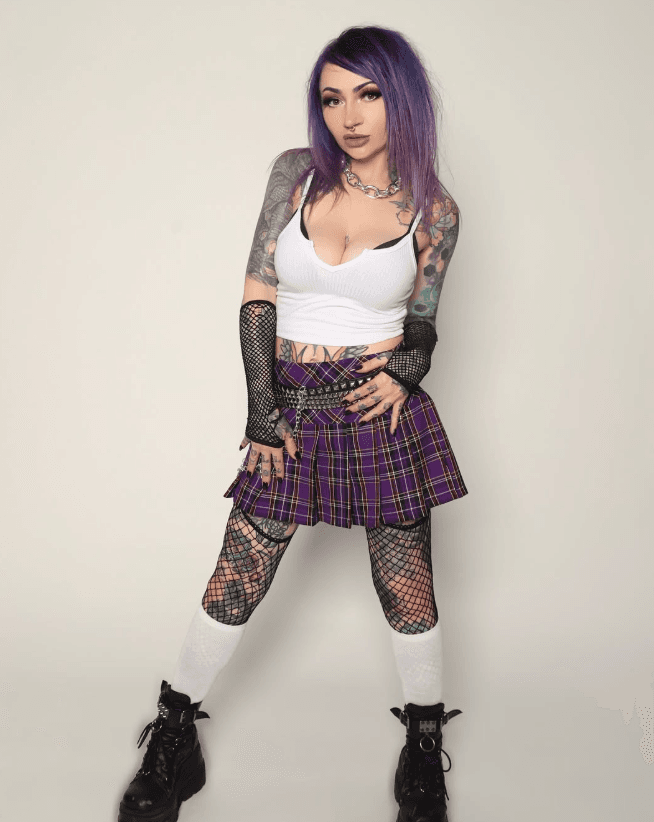 Courtney Raimondi in punk-inspired styling against a clean white backdrop.
